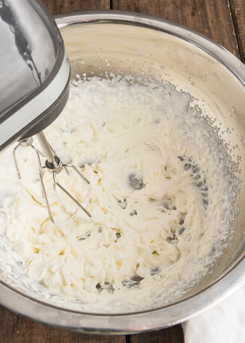 The cream whipped in a silver bowl.