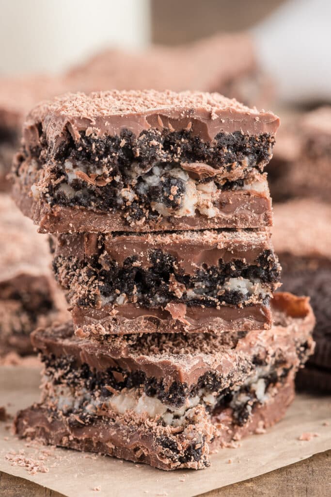 Three cookies and cream bars stacked.