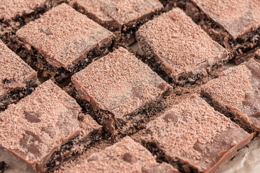 Cream bars cut on parchment paper.