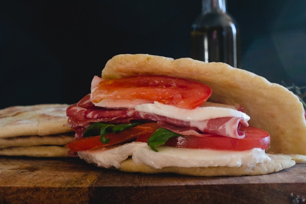 flat bread sandwich with cold meat mozzarella and tomatoes