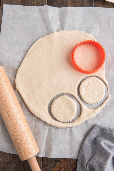 Cutting out the pizza rounds.