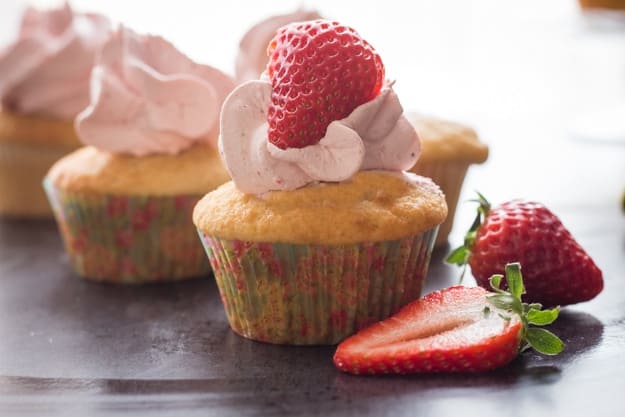 frosted cupcakes with strawberries