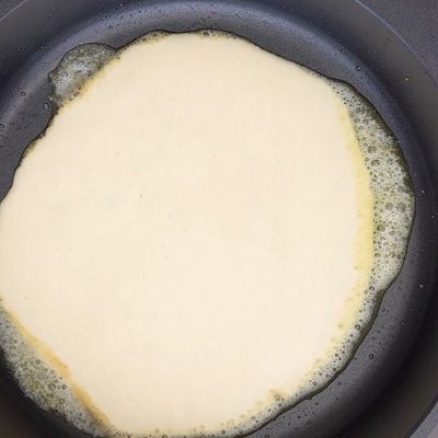 Crepe batter in a pan.