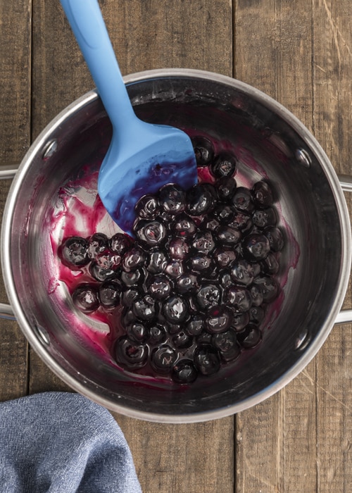 Making the blueberry filling in the pot.