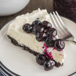 A slice of cheesecake on a white plate.