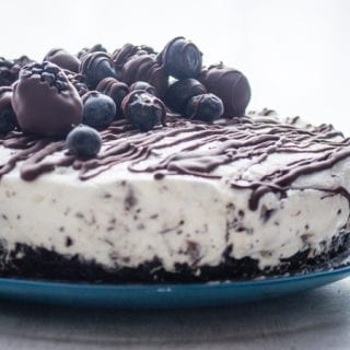 Light Cream Cheese Berry Cheesecake, a chocolate cookie crumb base and a creamy no bake chocolate chip filling. A delicious dessert recipe.