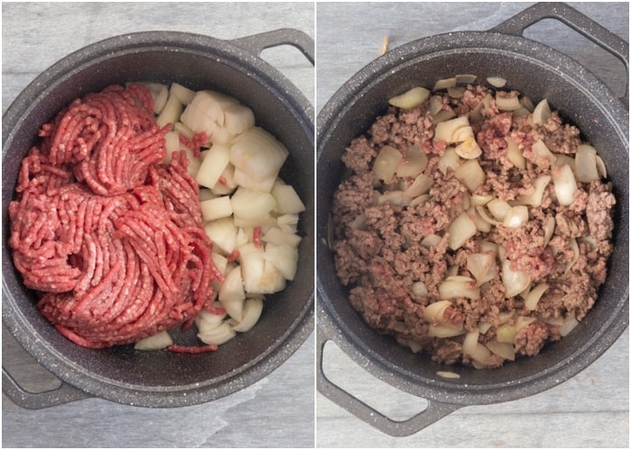 Browning the ground beef and onions in a black pot.