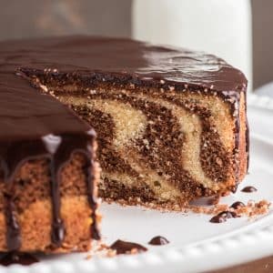 Marble cake with a slice cut.