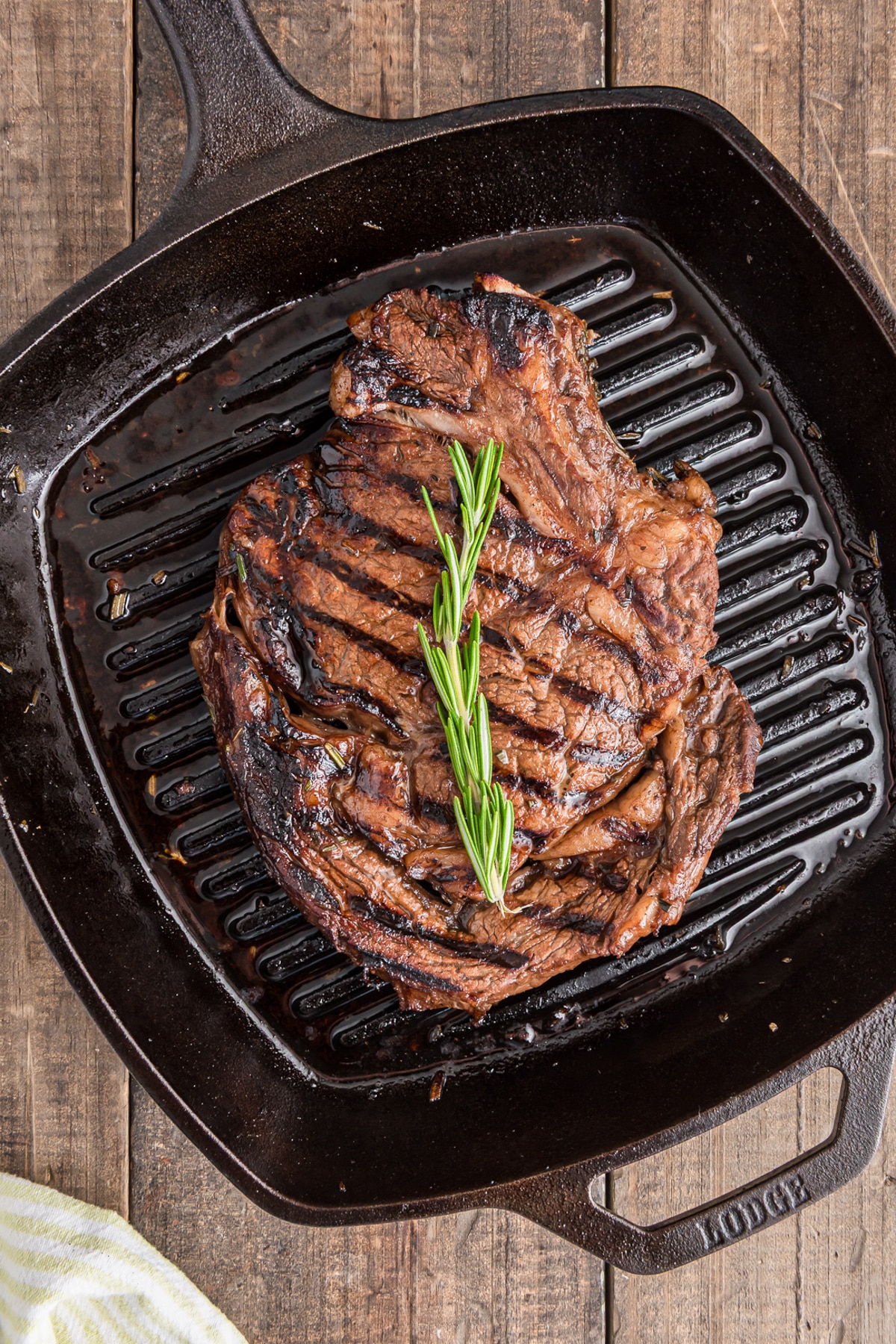 Rosemary steak on a black grill.