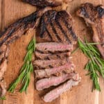 Steak sliced on a wooden board.