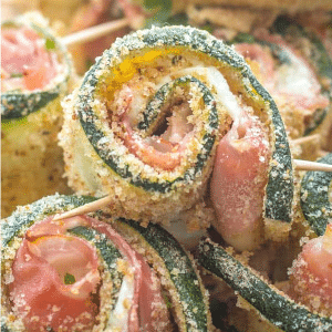breaded zucchini rollups on top of each other