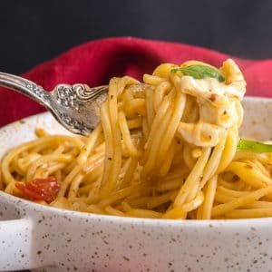 a fork of hot caprese pasta