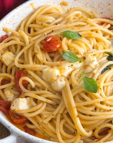 caprese pasta in a white dish