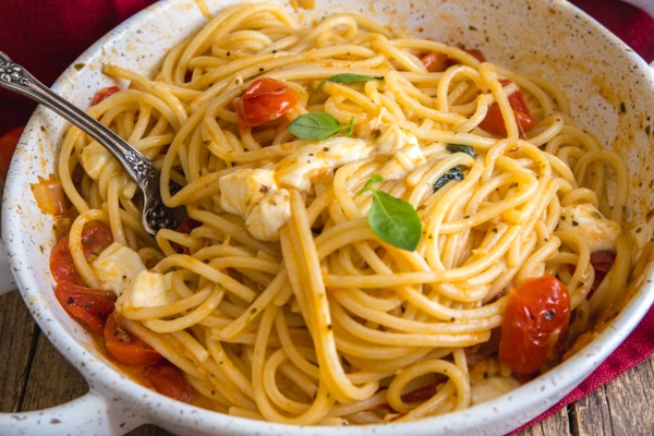 caprese pasta in a white dish