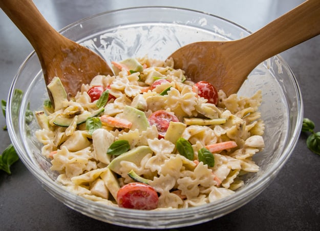 creamy italian pasta salad in a large glass bowl