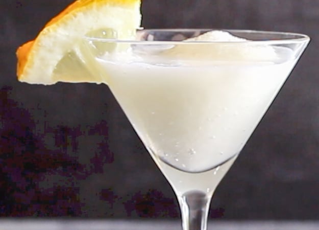 lemon sorbet drink with a slice of lemon on the rim 