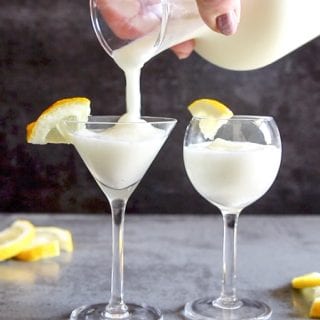 pouring lemon sorbet drink in a glass