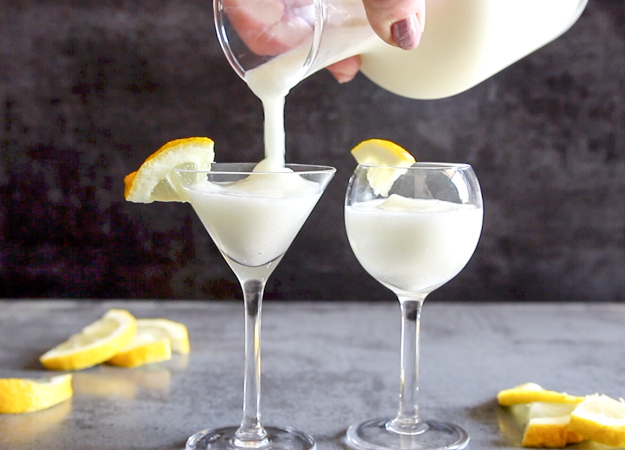 pouring lemon sorbet drink in a glass