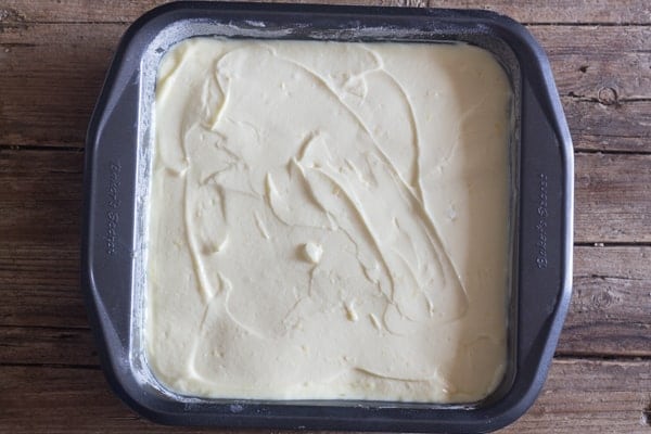 lemon cheesecake bars in a pan ready for baking