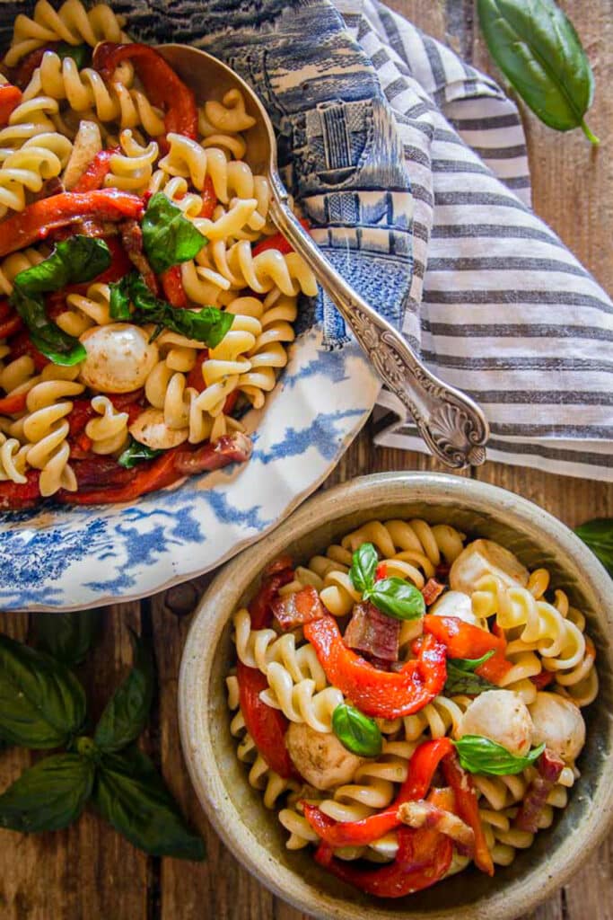 Pepper pasta salad in a bowl and in a small bowl.