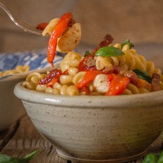 roasted pepper pasta salad in a bowl