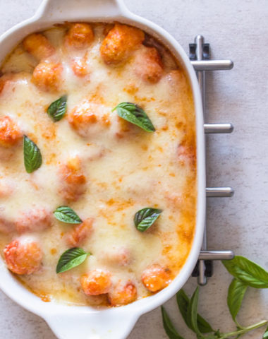 Baked gnocchi in a white pan.