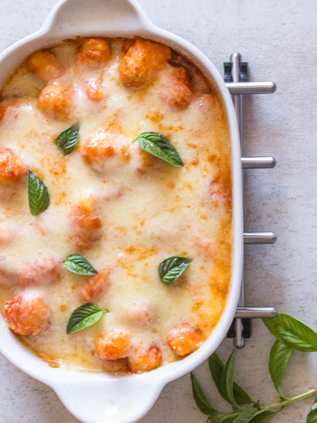 Baked gnocchi in a white pan.