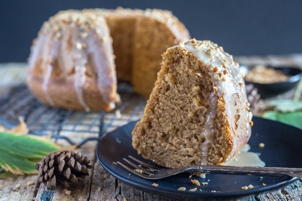 pumpkin cinnamon glaze cake, a slice on a black plate