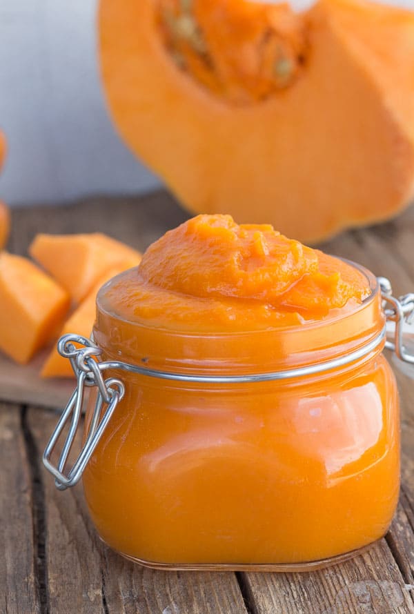 Pumpkin puree in a glass jar.