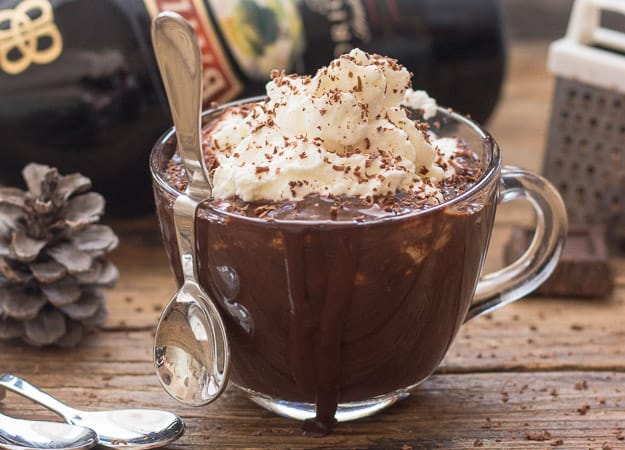 thick italian hot chocolate in a glass coffee mug with spoon
