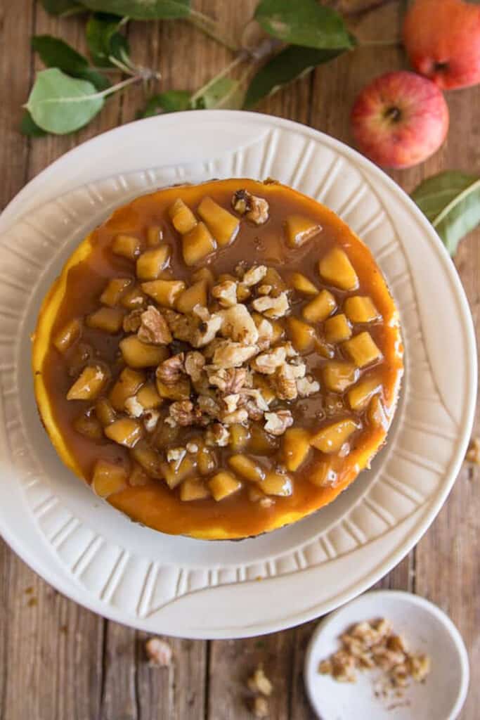 Apple cheesecake on a white plate.