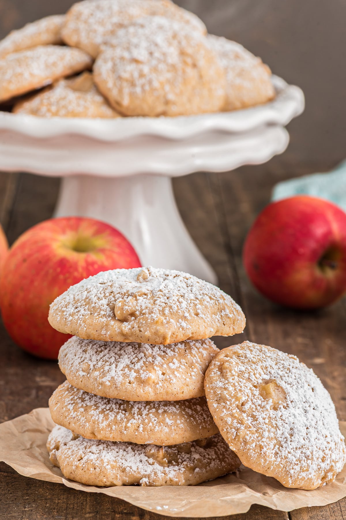 Cookies in a white plate and four stacked.