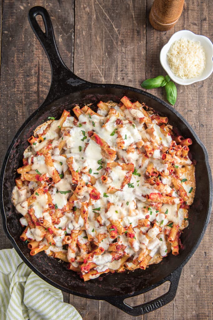 The baked pasta in a black pan.