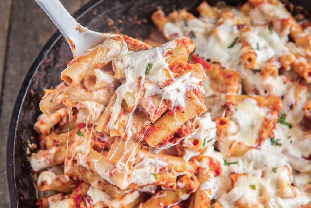 Baked pasta on a large spoon.