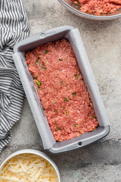 Half the meatloaf in the loaf pan.