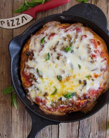 Easy Cast Iron Skillet Pizza, this deep dish Pizza Recipe is made with a simple sauce and a tasty filling & topped with Mozzarella Cheese.