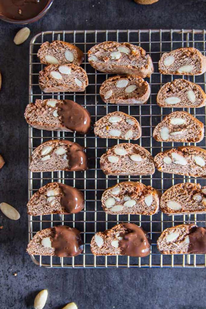 Chocolate almond biscotti on a wire rack.