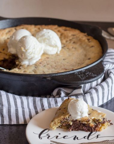 Double Chocolate Chip Skillet Cookie, an easy Cast Iron cookie recipe, stuffed with melted dark chocolate. Top with ice cream so delicious.