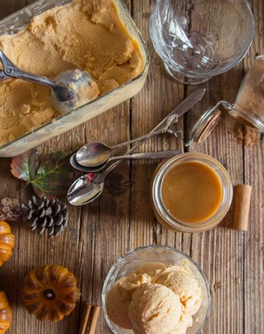 easy homemade pumpkin gelato on a wooden board, in a bowl, with cinnamon,