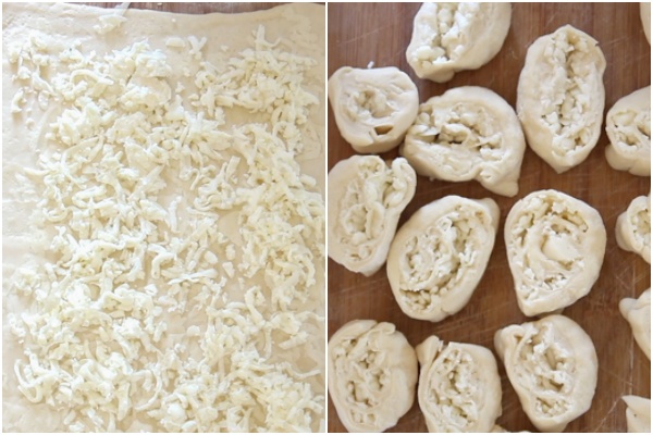 Making the pinwheels, the dough rolled and shredded cheese on top, roll up and sliced.