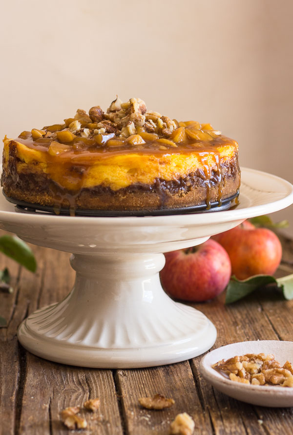 Maple Caramel Apple Cheesecake, an easy homemade dessert recipe, a filling made with fresh apples, and a delicious pecan caramel topping.