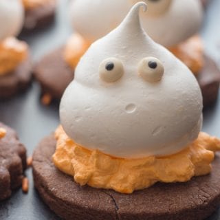 upclose photo of a meringue ghost chocolate sugar cookie