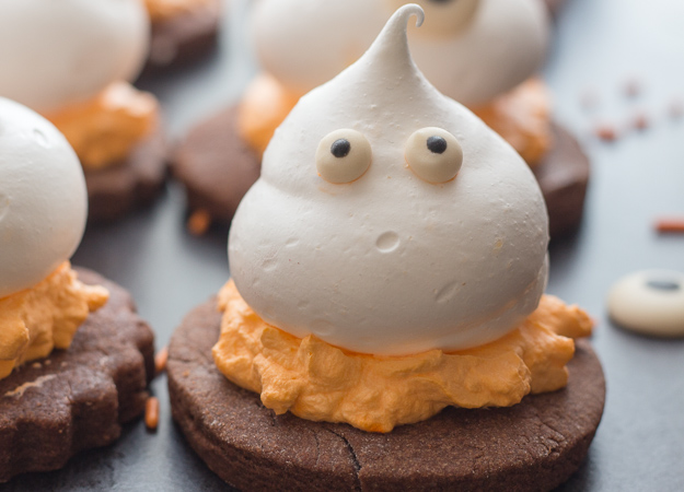 upclose photo of a meringue ghost chocolate sugar cookie