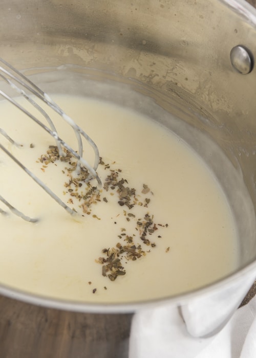 Making the white sauce in the sauce pan.