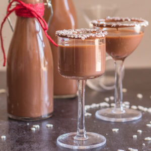 Two glasses Nutella liqueur and in two bottles.