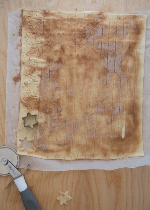 The dough cut and sprinkled with cinnamon sugar.