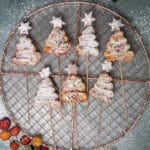 Seven puff pastry Christmas trees on a wire rack.