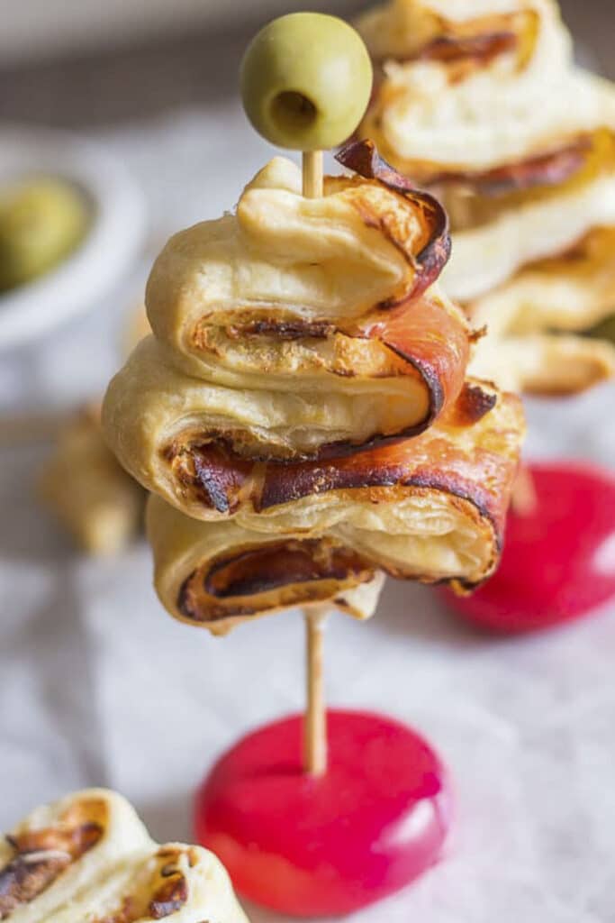 Puff pastry appetizer on parchment paper.