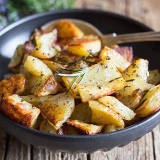 rosemary roasted potatoes in a black bowl