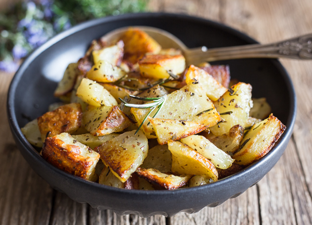 rosemary roasted potatoes in a black bowl